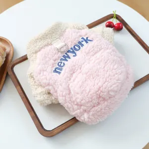 Close-up detail of the cozy pink sherpa dog fleece hoodie with cute embroidery and ring.