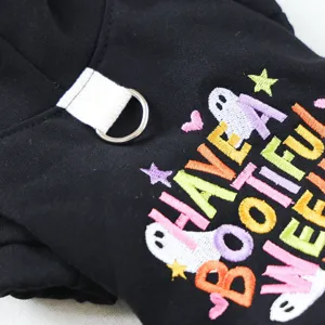 Pet hoodie detail shot, black dog sweatshirt with cute Halloween ghost embroidery and leash D-ring.