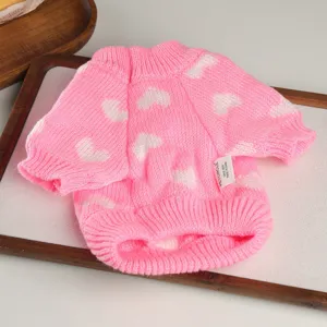 Cute pink knitted pet sweater with white hearts pattern, cozy and warm for small dogs and puppies.