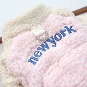Close-up detail of cute pink and cream pet fleece hoodie with newyork embroidery and d-ring.