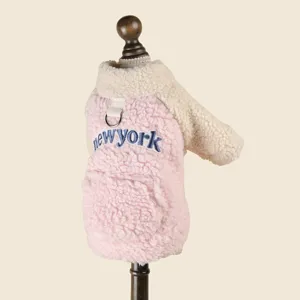 Cute pink plush pet dog hoodie with fleece sleeves and New York embroidery detail.