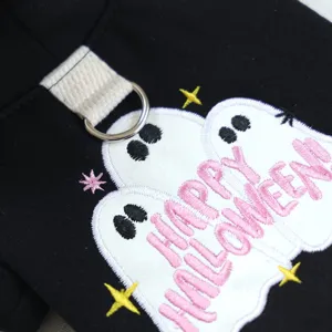 Close-up detail of pet Halloween hoodie featuring cute embroidered ghost and metal D-ring.
