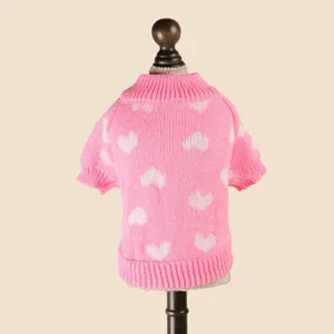 Cute pink knitted pet sweater with white hearts, warm and cozy apparel for small dogs.