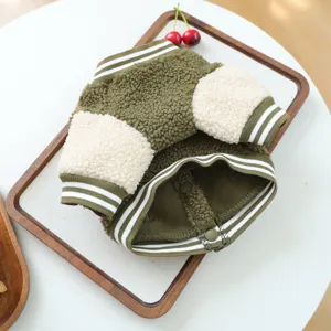 Green and white fleece pet baseball jacket, cute puppy winter warm coat flat display.