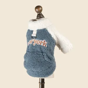 Detailed close-up view of cute pet dog fleece sweatshirt in gray and white with leash ring.