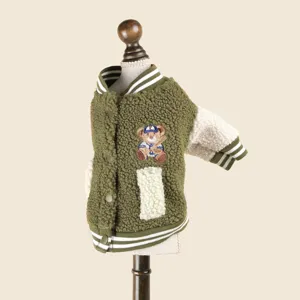 Detailed view of green fleece pet baseball jacket with cute bear embroidery and striped ribbed cuffs.