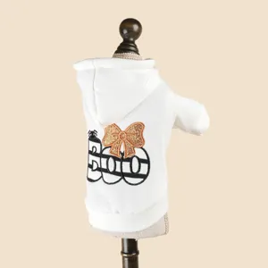 Detail view of white pet hoodie back featuring BOO embroidery and cute golden bow design.