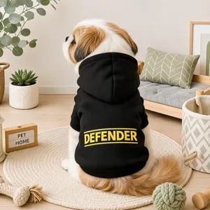 Detailed back view of a small dog wearing a stylish black hoodie with yellow defender text.