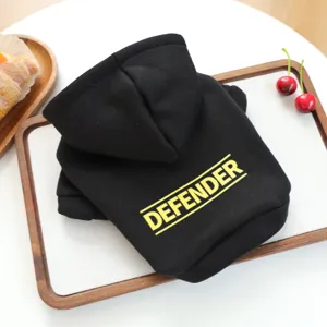 Black pet hoodie detail showing cute yellow letter print on soft fabric for small dogs and cats.