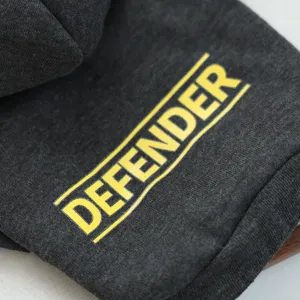 Dark grey pet hoodie detail featuring a striking yellow Defender print for small dogs.