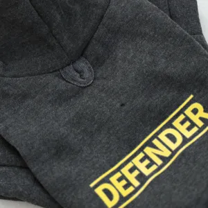 Dark grey pet hoodie detail with yellow Defender letter print for small dogs and puppies