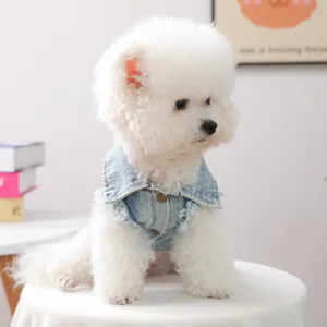 Detail view of a cute fluffy dog wearing a stylish retro denim vest, pet apparel.