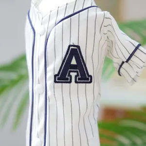 Close up detail of pet baseball jersey with navy pinstripes and embroidered letter A.