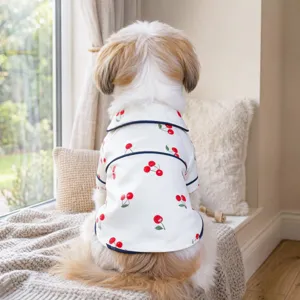 Cute pet cherry print pajama top detail showing soft white fabric and red cherries.