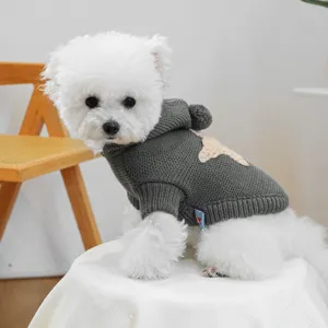 Detailed view of the cute grey dog sweater with Nordic star pattern and cozy hoodie design.