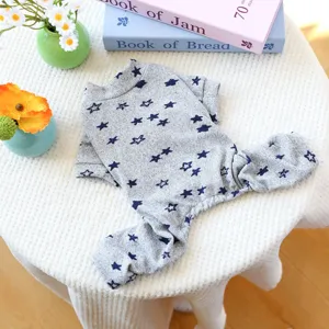Grey pet jumpsuit for small dogs with blue star print, comfortable cotton puppy pajamas.
