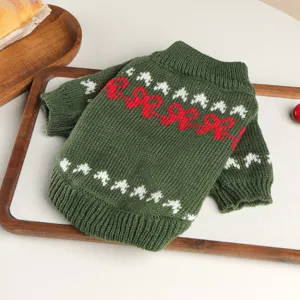 Green knitted pet sweater for small dogs, cozy winter pet apparel with festive patterns.