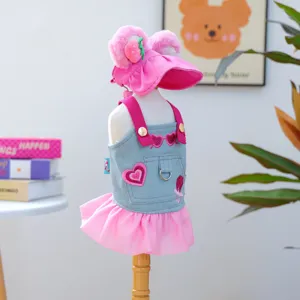 Cute pink pet denim dress with matching sun hat for small dogs and cats, detailed set.