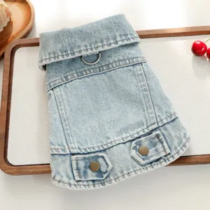 Detailed view of stylish pet denim jacket for small dogs with metal rings and buttons.