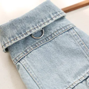 Dog denim jacket detail shot, vintage light blue pet coat with ring for small dogs.