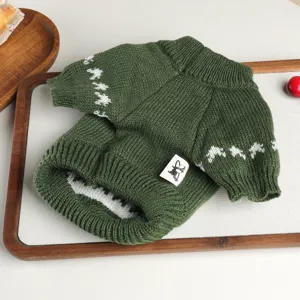 Green knit pet sweater with white sleeve patterns and cute tag, soft dog apparel for autumn.