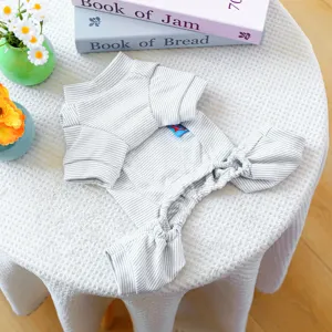 Cute striped pet onesie jumpsuit for small dogs and puppies, cozy home wear detail shot.
