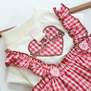 Red white checkered pet dress with cute heart embroidery and leash ring detail for dogs cats.