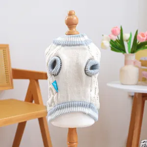 Knit pet sweater for small dogs, cozy beige pullover with blue trim, detailed knit pattern.