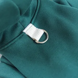 Dark green pet dog hoodie detail showing white strap and metal D-ring for safe leash attachment.