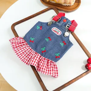 Cute pet denim overall dress with red checkered ruffles and lovely cherry embroidery details.