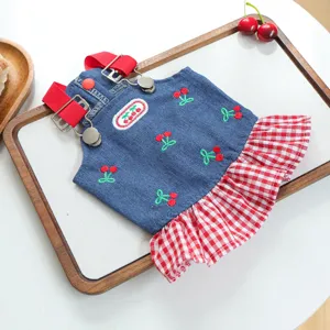 Cute denim pet dress with cherry embroidery and red checkered ruffle hem for dogs and cats.