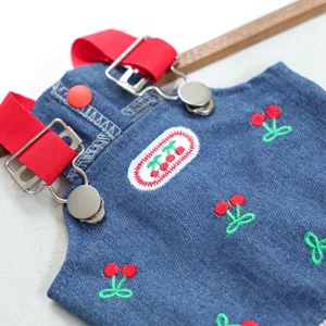 Pet denim overall dress with cute cherry embroidery and red straps for dogs and cats.