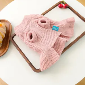 Detailed view of the pink knitted pet sweater for small dogs, cozy and warm pet apparel.