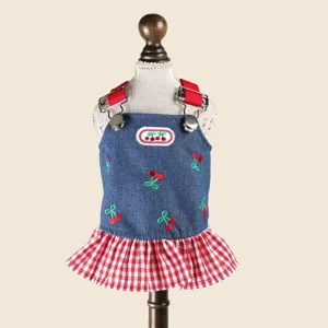 Cute cherry embroidery pet denim dress detail, red checkered ruffle hem and straps.