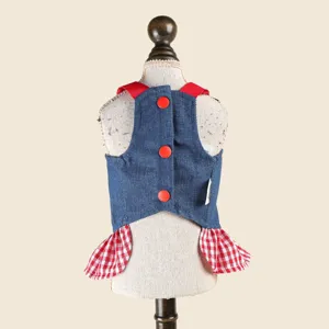 Cute denim dog overall dress featuring a red plaid skirt and buttons for sweet pets.