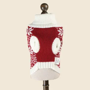 Pet Christmas sweater detail, red and white knit fabric with classic snowflake pattern design.