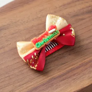 Weihnachten Haarklammer Detail für Haustiere, süße Welpen Schleife in rot und gold Design.