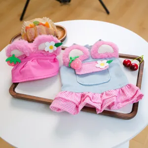 Detailed view of cute pet clothes set featuring plush ears, strawberry and pink denim skirt.