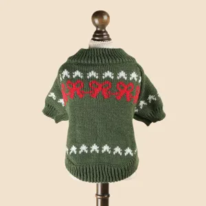 Green knit pet sweater for small dogs puppies with cute red bows and white holiday patterns.