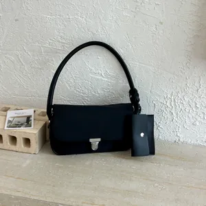 Retro minimalist nylon underarm shoulder bag for women, chic commuter casual handbag.