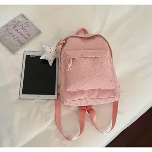 Sac à dos rose avec motif étoiles pour femmes, cartable élégant avec poche avant et bretelles.