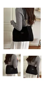 Gedetailleerd overzicht van een grote zwarte shopper tas met ketting voor dagelijks werk.