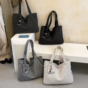 Detailed view of casual striped canvas tote bags with mini coin pouch, multi-color display scene.