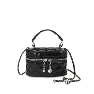 Black patent leather quilted mini handbag with chain strap and cute heart charm.
