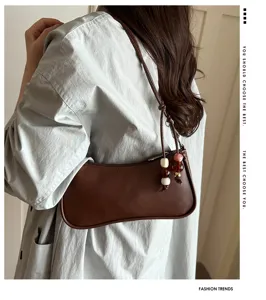 Chic brown PU shoulder underarm bag detail, minimalist commuter style with beaded charm accent.