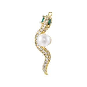 Detail view of a gold plated snake pendant with sparkling cubic zirconia and white pearl.