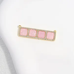 Close-up detailed view of the copper zircon-paved four-square pink charm for DIY jewelry making.