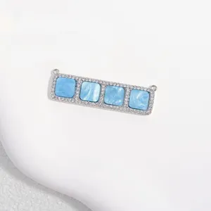 Close-up detail of rectangular silver copper cubic zirconia 4-square connector charm DIY jewelry.