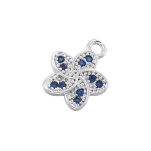 Silver tone copper five petal flower pendant charm with blue crystals for DIY jewelry making.