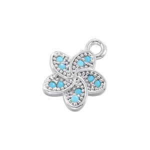 Detailed view of the five-petal flower pendant with turquoise stones and shimmering pavé.